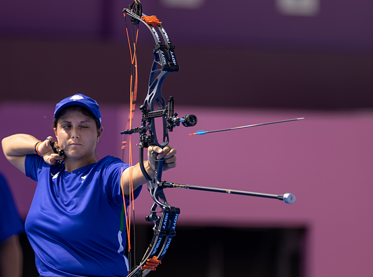 A female Para archer shoots an arrow